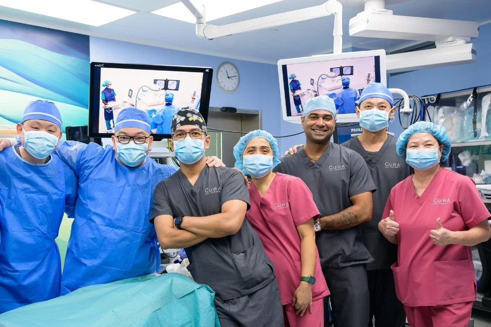 podiatrist Jackie Tey with orthopaedic doctors and his surgical team in an operating theatre